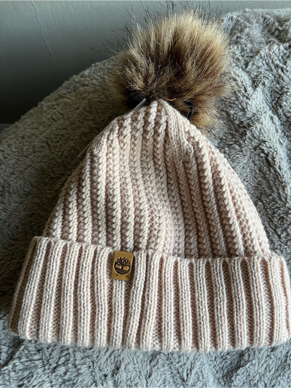 Timberland cable knit beanie with faux fur Pom Pom